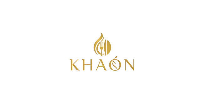 Elegant gold Kha&oacute;n logo with flame embracing culinary cutlery.