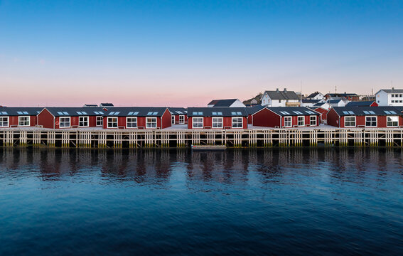 Colorful houses by the water at dusk in a quiet town