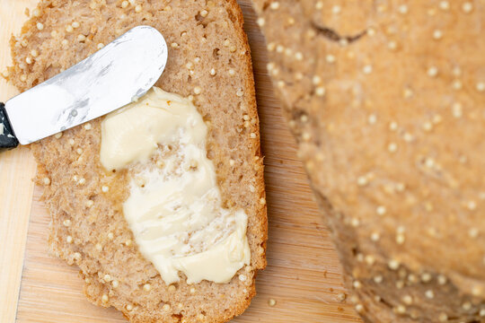 Homemade millet wheat bread on breadboard room for copy