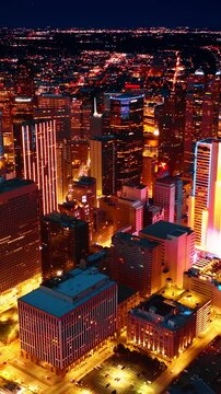 Footage rising above the dazzling well-lit panorama of Dallas, Texas, USA. Breath-taking view of metropolis at night. Vertical video