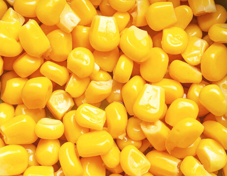 Cooked yellow corn kernels, top view, full frame, closeup. AI
