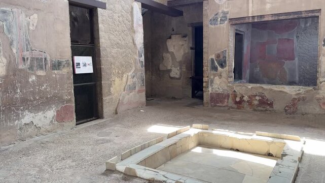 Preserved Room with Impluvium and Painted Walls in a Roman Villa of Herculaneum