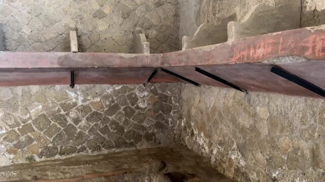 Ancient Stone Shelving and Niches Inside the Roman Baths of Herculaneum