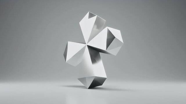 A 3D rendering of a geometric object with multiple facets on a plain surface indoors.