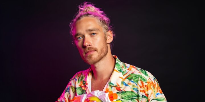 Young man posing with colorful hair in studio portrait