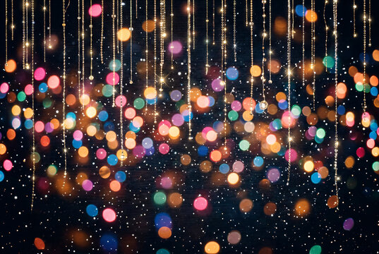 Twinkling festive colorful bokeh lights and sparkles background for holiday celebration and party events