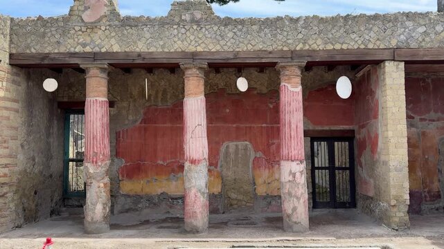 Exterior Facade of an Ancient Roman Villa in Herculaneum with Red Pillars