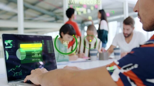 Man at laptop tapping trackpad and updating HUD for data while camera panning revealing profile