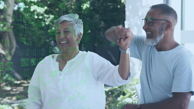 Man lifting arm guiding twirl on patio, transparent tech overlay appearing left, couple sharing joy
