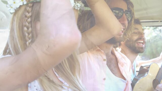 Three friends clapping and singing in van when driver strumming guitar, showing travel with shades