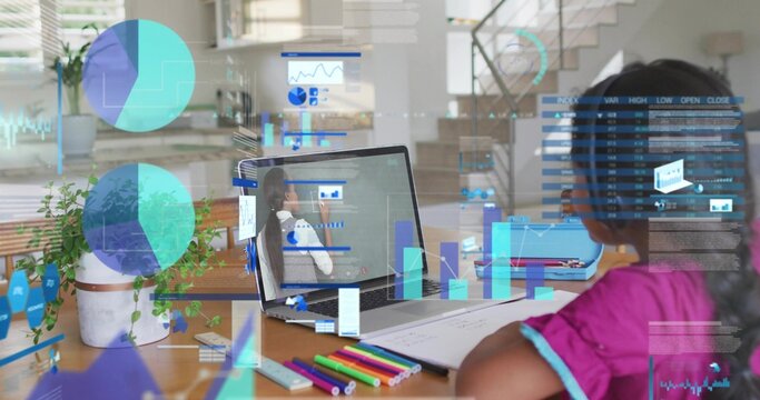Studying child wearing magenta top taking notes at wooden table at home, laptop charts, copy space