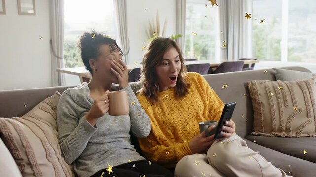 Right woman tapping phone and pointing to surprising post, left reacting, stars floating marketing