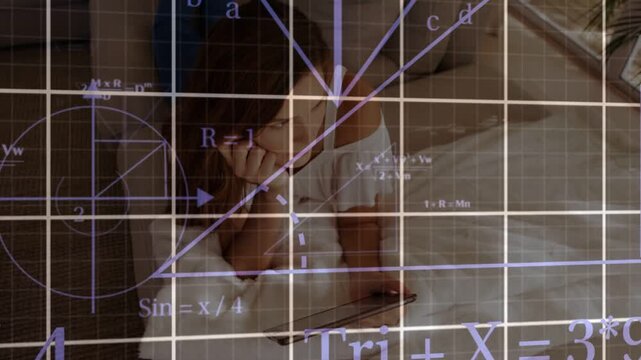 Woman propping head on bed, holding tablet, tablet activating animated learning grids crossing her
