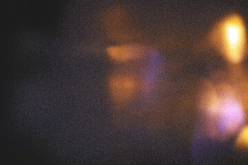 Dark grainy film texture overlay with colorful bokeh light leaks, orange yellow and purple pink lens flare on dark background, retro analog cinematic grain noise, transparent PNG © Pixora
