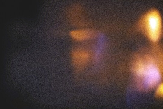 Dark grainy film texture overlay with colorful bokeh light leaks, orange yellow and purple pink lens flare on dark background, retro analog cinematic grain noise, transparent PNG
