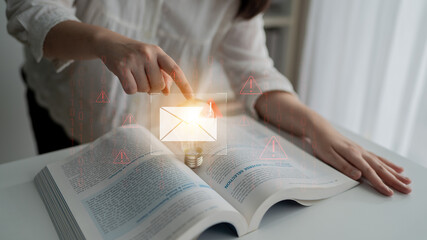 Phishing email alert concept showing digital envelope with warning sign represents data theft, network breach, and email security threats. Parse © InfiniteFlow