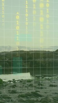 Vertical video: Grid appearing, pixel panel rising and binary rain falling over rock coast, mapping