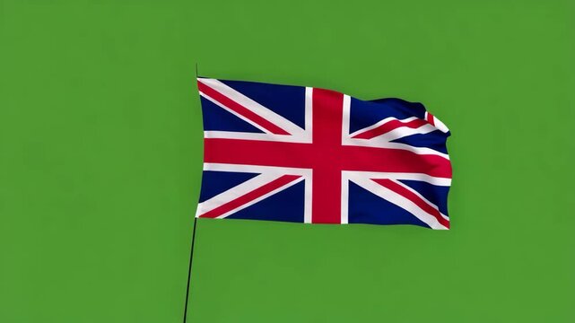 The united kingdom flag waving on a green background with a pole