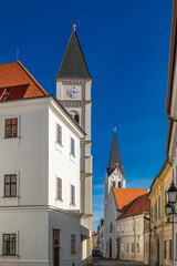 Obraz premium Church tower clock historic architecture street in the castle district of Veszprém, Hungary