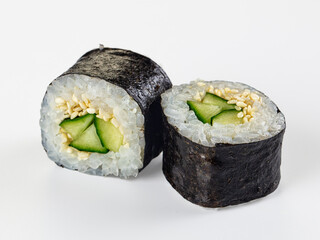 Two cucumber and sesame maki sushi rolls isolated on white background © Andrei Starostin