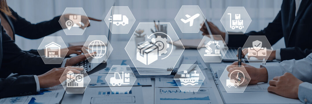A business team collaborates on logistics and supply chain strategies, utilizing digital icons to enhance communication and improve tracking efficiency in a professional setting. Ledger