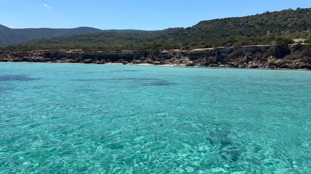 Blue lagoon with turquoise water in Mediterranean Cyprus Akamas landscape, ideal for tourism and travel marketing. Coastal nature highlights relaxation, destination branding and summer lifestyle