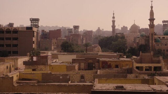 Cairo aerial view of the City of the Dead and garbage city. Smooth Steadicam shot from a slightly elevated perspective showing the contrast between Cairo&rsquo;s City of the Dead 