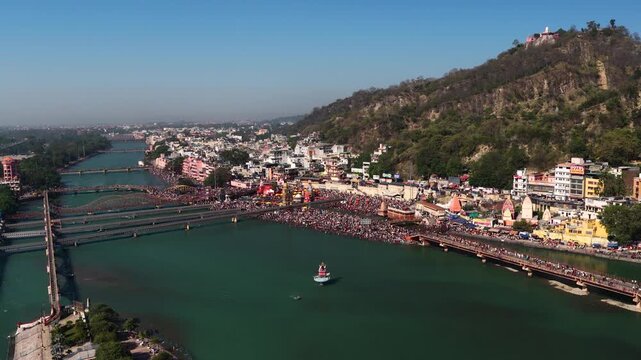 Wide aerial view of har ki pauri, haridwar with lot of people, 6k footage