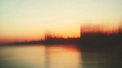 Naklejka premium As twilight settles, the city skyline transforms into a dreamlike silhouette against the radiant hues of sunset. Reflections shimmer on the calm water's surface, enchanting all who gaze upon it