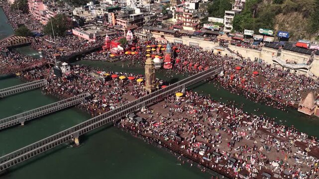 Aerial view of Har ki Pauri Haridwar, Crowd of pilgrims bathing in holy ganga 4k footage