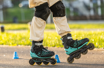Obraz premium Girl Practicing Tricks On Rollerblades