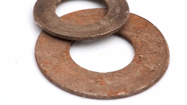 Pair of rusty metal washers isolated on white background