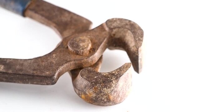Rusty old carpenter pincers tool isolated on white background