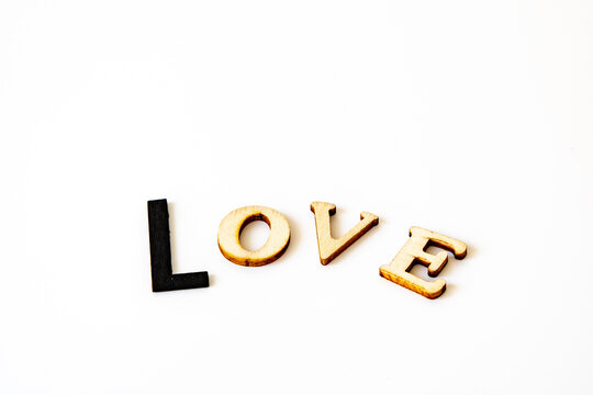 valentines message love in wooden letters the type L is black and bigger than the other types