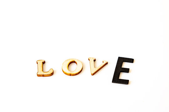 valentines message love in wooden letters the type E is black and bigger than the other types