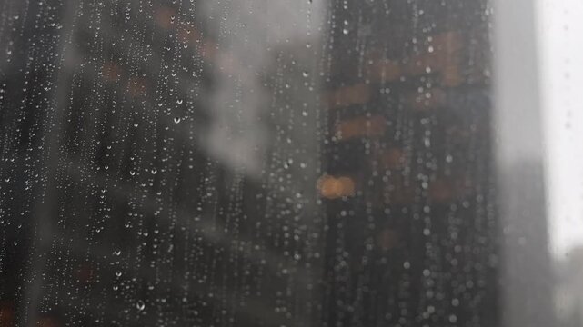 Light Rain Falls On Downtown Window