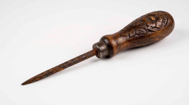 Antique Ice Pick with Carved Wooden Handle on White Background