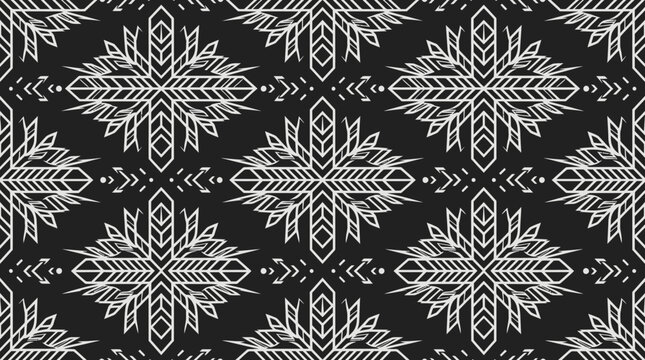 Repeating white geometric star patterns on a black background suitable for textiles, wallpapers, and graphic design projects.