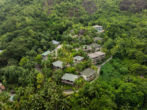 Baie Lazare, Seychelles - 05 April 2026: Aerial view of ValMer Resort nestled among lush tropical greenery and palm trees on a hillside.