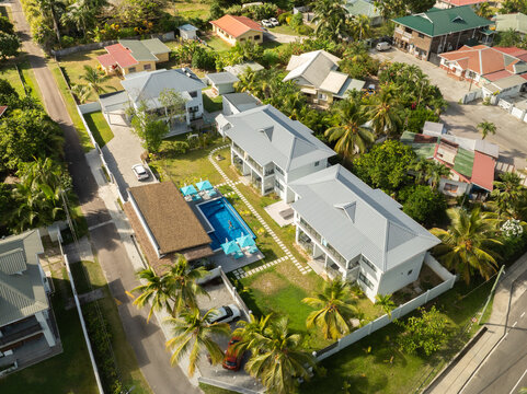 Baie Lazare, Seychelles - 05 April 2026: Aerial view of Anse La Mouche Villas with a blue swimming pool, modern architecture, and lush tropical greenery.