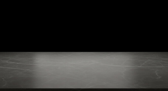 Dark gray marble countertop surface with subtle veining showcasing a reflective texture against a stark black background ideal for product placement or studio display mockups