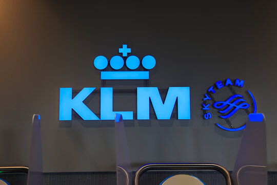 KLM and SkyTeam logos illuminated at Amsterdam Schiphol International Airport
