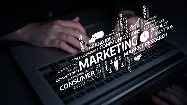 Close-up of hands typing on a laptop keyboard surrounded by marketing concepts. Ideal for illustrating digital strategies and consumer research in business environments. Tessel