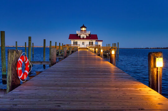 A nightscape photo of the Roanoke Marshes Lighthouse in Manteo, North Carolina in the Eastern United States