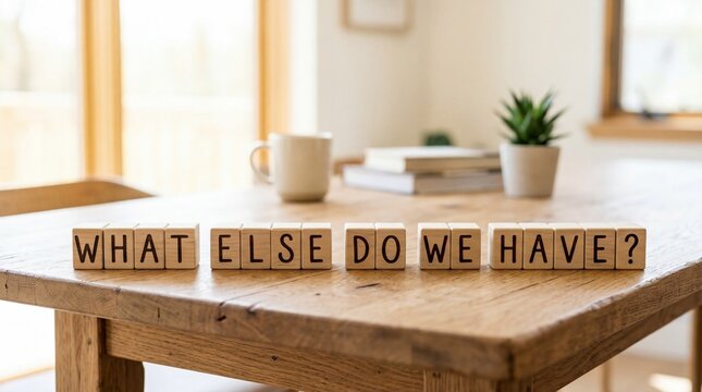 Wooden Blocks Spell Out Question What Else Do We Have on Table.