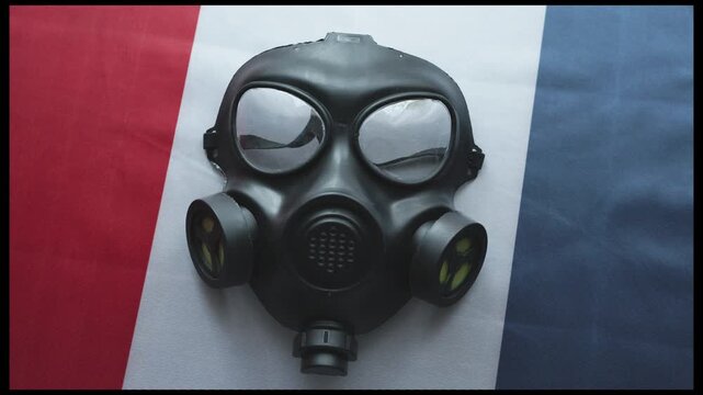 Close-up of gas mask on France flag