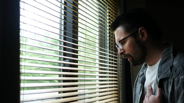 Man in his thirties experiences heart or chest pain - health concept
