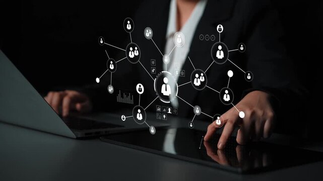 Professional businesswoman using laptop with digital network interface showcasing connections and data visualization for modern work environment Gluon.