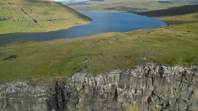 Cinematic 4K aerial drone soaring over the rugged cliffs of Bosdalafossur, Faroe islands