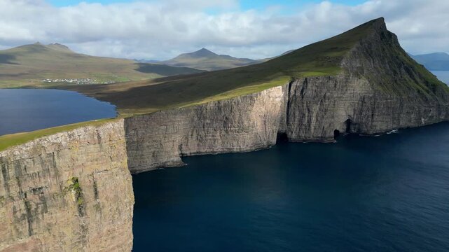 Cinematic 4K aerial drone soaring over the rugged cliffs of Bosdalafossur, Faroe islands